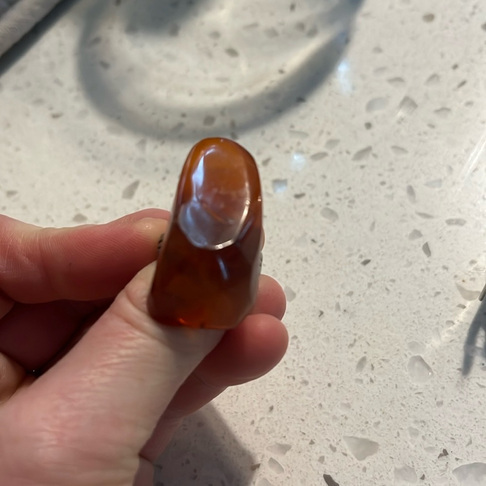 Amber colored ring with adjustable band
